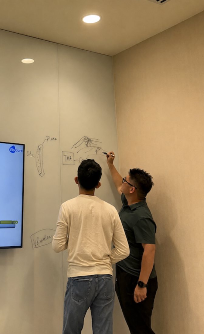 EloCare team sketching the device form on the whiteboard