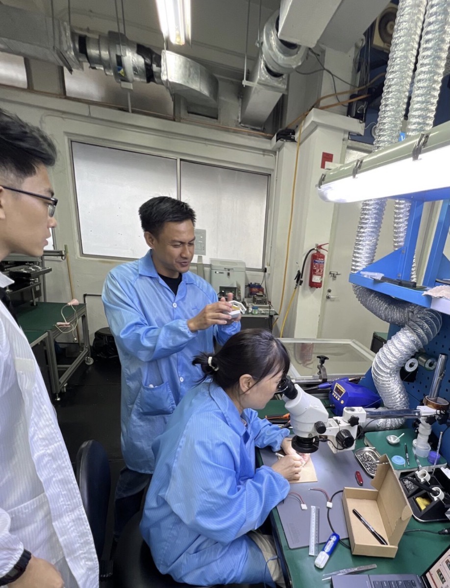 EloCare team hand-building and bench-testing a prototype in the lab
